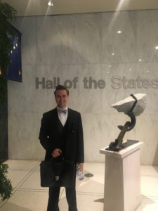 2018 D.C. Experience Scholarship Recipient Wyatt Anderson in front of a piece of artwork at the Hall of States.